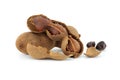 Tamarind whole and cracked open on white background Royalty Free Stock Photo