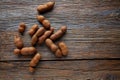 Tamarindo tamarind fruits ripe on brown wood