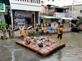 Tambora, jakarta, In a janitor cleaning trash in a river near a densely populated area