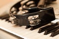 Tambourine lying on the piano keys Royalty Free Stock Photo