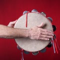 Tambourine Played On red Royalty Free Stock Photo