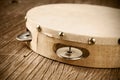 Tambourine on a rustic wooden table, retro look Royalty Free Stock Photo