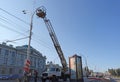 Repairmen repair a lamp on Tambov street