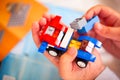 Child building Lego car.