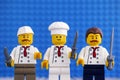 Three Lego chefs with knives