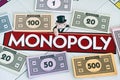 Center of Monopoly gameboard with money packs.