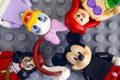Four Lego Disney minifigures - Mickey Mouse, Daisy Duck, Ariel,