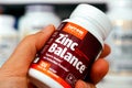 Bottle of Zinc Balance pills by Jarrow Formulas in woman hand