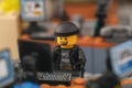 Tambov, Russian Federation - September 30, 2023 A Lego robber minifigure hacking computers in an office