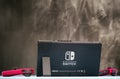 Nintendo Switch video game console on the table against black background