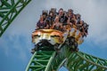 People amazing terrific Cheetah Hunt rollercoaster on lightblue cloudy sky background 58