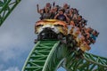 People amazing terrific Cheetah Hunt rollercoaster on lightblue cloudy sky background 54.