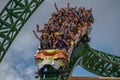 People amazing terrific Cheetah Hunt rollercoaster on lightblue cloudy sky background 55. Royalty Free Stock Photo