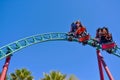 Nice people and kids enjoyins amazing Cobra`s Curse rollercoaster at Bush Gardens Tampa Bay Theme Park