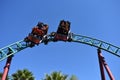 Riders enjoying spinning Cobra`s Curse Rollercoaster at Bush Gardens Tampa Bay Theme Park.