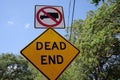 Low angle of a dead end street sign with a closeup view of no truck entry signage