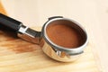 Tamped coffee in bottomless portafilter Royalty Free Stock Photo
