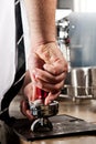 Tamper and barista Royalty Free Stock Photo