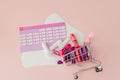 Tampon, feminine, sanitary pads for critical days, feminine calendar, pain pills during menstruation on a pink background. Royalty Free Stock Photo