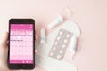 Tampon, feminine, sanitary pads for critical days, feminine calendar, pain pills during menstruation on a pink background. Royalty Free Stock Photo