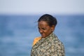 Tamul old woman from Sri Lanka smiling in the beach