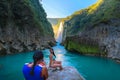 TAMUL, SAN LUIS POTOSI MEXICO - January 6, 2020:young women posing in River amazing crystalline blue water of Tamul waterfall Royalty Free Stock Photo