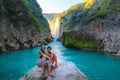 TAMUL, SAN LUIS POTOSI MEXICO - January 6, 2020:young women posing in River amazing crystalline blue water of Tamul waterfall Royalty Free Stock Photo
