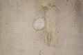 Light brown concrete wall texture with plastered hole. Background and wallpaper texture Royalty Free Stock Photo