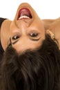 Tan female model upside down portrait mouth open