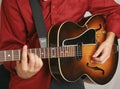 Tan and gold acoustic guitar