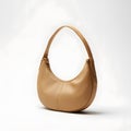 Tan Leather Hobo Bag with Gold Hardware Highlighting Elegant Design and Stylish Functionality Royalty Free Stock Photo