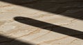 Tan marble surface with intricate brown and beige vein patterns. Shadows from Royalty Free Stock Photo