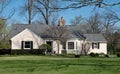 Tan Painted Brick House with Bay Window