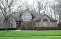 Tan Speckled Brick House with Arched Windows