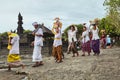 Hindus carrying ceremonial equipment and offerings on their heads