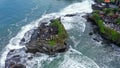 Tanah Lot Temple on the rock in Sea. Ancient hinduism place of worship. Sunlight. Aerial view. Bali, Indonesia Royalty Free Stock Photo