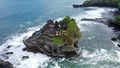 Tanah Lot Temple on the rock in Sea. Ancient hinduism place of worship. Sunlight. Aerial view. Bali, Indonesia Royalty Free Stock Photo