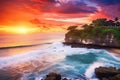 Tanah Lot temple at sunset, Bali island, Indonesia, Seascape, ocean at sunset. Ocean coast with waves near Uluwatu temple at