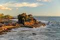 Tanah Lot temple in the sunset extending into the ocean in Bali Royalty Free Stock Photo