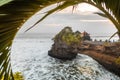 Tanah Lot water temple in Bali at sunset. The famous Hindu temple main landmark of Bali. Indonesia. Royalty Free Stock Photo