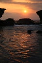 Tanah Lot with water and temple at sunset