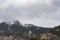 Tandem flight high up in the sky, above a Mountain with clouds and snow Royalty Free Stock Photo