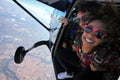 Tandem parachute jump. Beautiful Brazilian woman Royalty Free Stock Photo