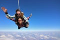 Tandem parachute jump. Beautiful Brazilian woman Royalty Free Stock Photo