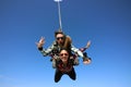 Tandem parachute jump. Beautiful Brazilian woman Royalty Free Stock Photo