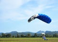 Tandem parachute jump at the moment of landing shot