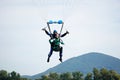 Tandem parachute jump shortly before the moment of landing shot