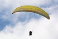 Tandem Paraglider flying in a blue sky Royalty Free Stock Photo