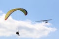 Tandem Paraglider flying in a blue sky Royalty Free Stock Photo