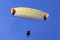Tandem Paraglider flying in a blue sky Royalty Free Stock Photo